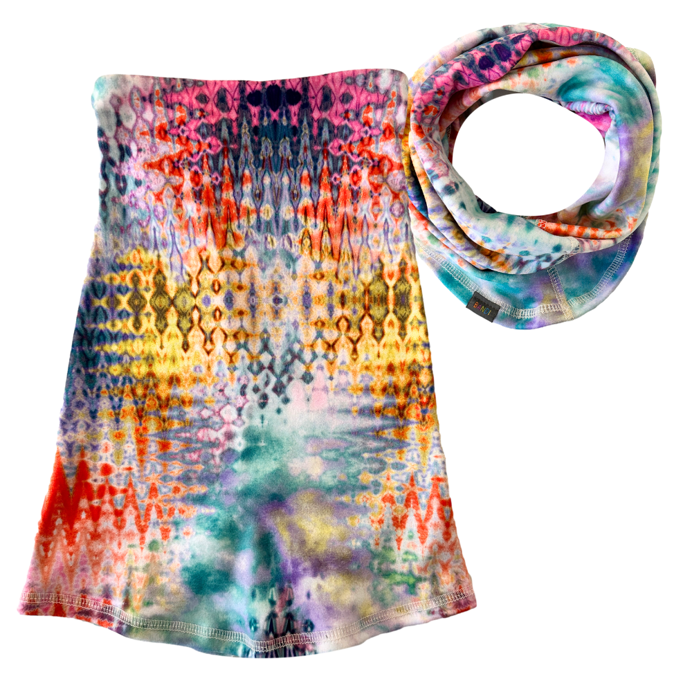 Product shot of multicolor Cozy Wrap. Shown flat and scrunched up.