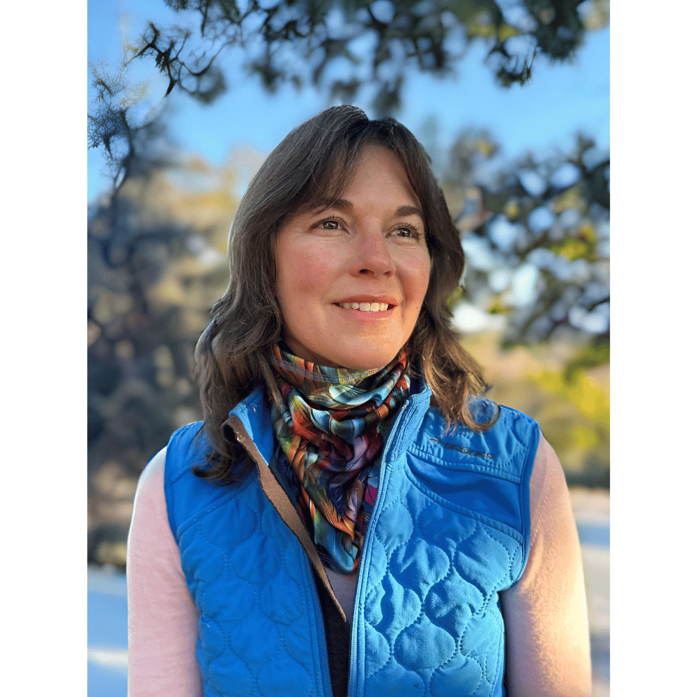 Woman wearing plumes Cozy Wrap by BANDi around neck.