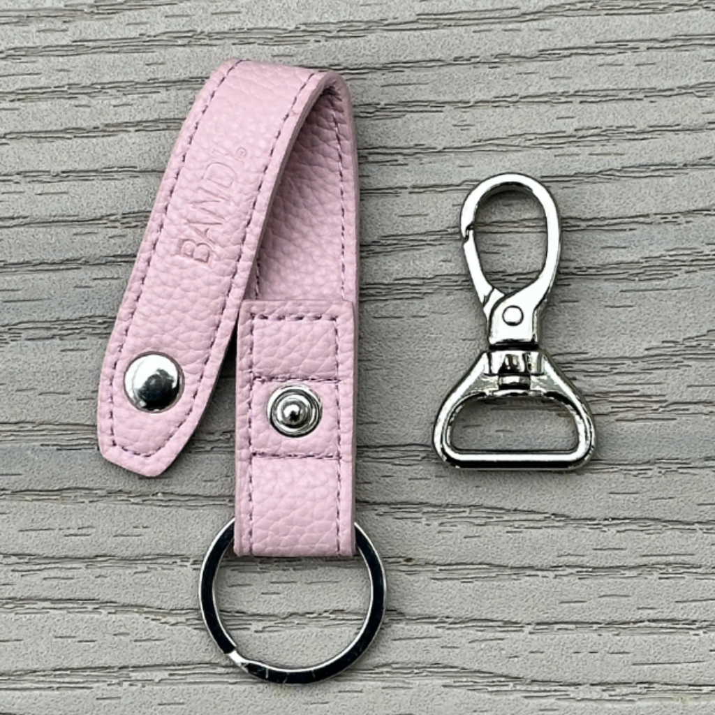 BANDI Wear Blush pink faux leather strap shown with clip removed.