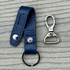 Navy leather key chain shown with removable clip