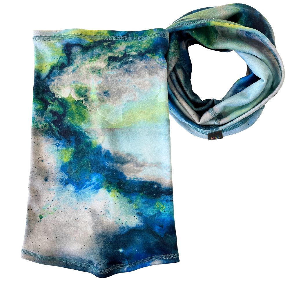 Product shot of Astrid Cozy Wrap in multi color print of blues and greens.