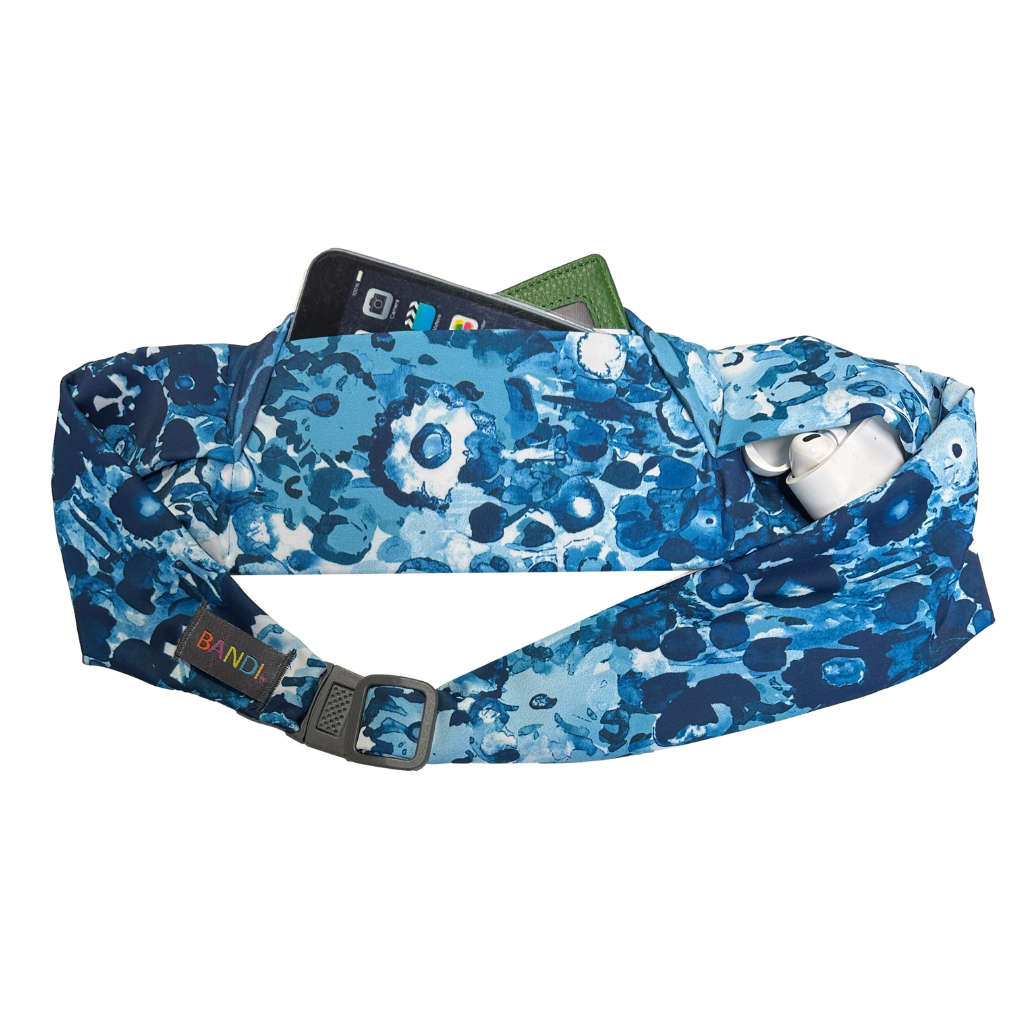 BANDI Wear Pocketed Belt in Lagoon print. Blue and white floral print and showing items in pocket.