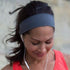 Woman exercising wearing BANDI Grey headband