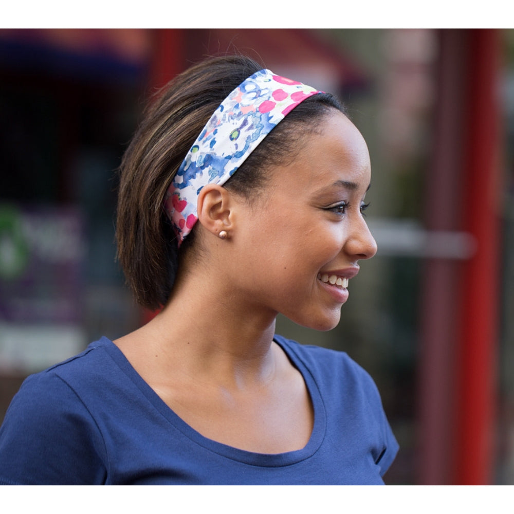 Woman wearing BANDI Poppies headband and smiling
