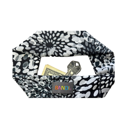 Black and white patterned headband for key or cash.