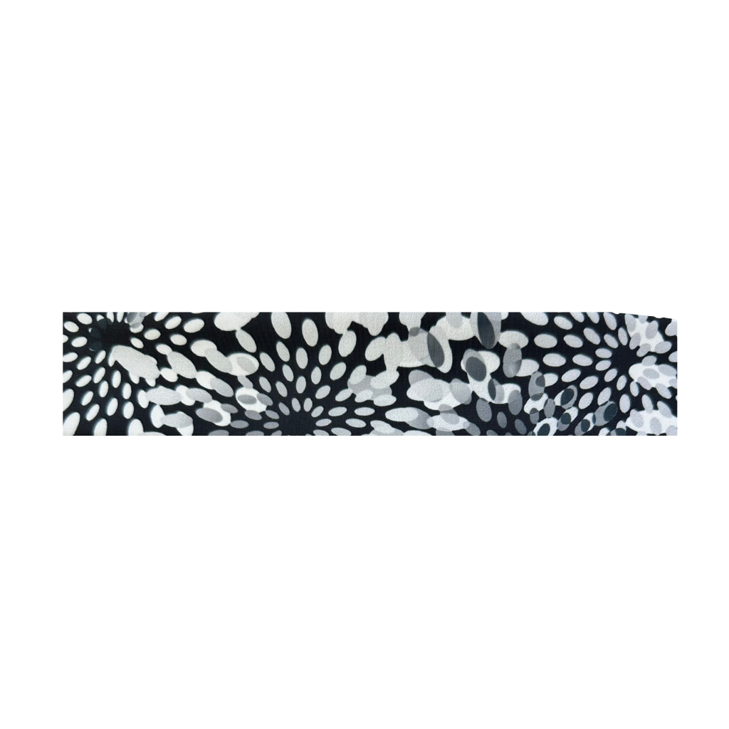A Pocketed headband with a black and white floral print design.