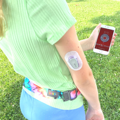 Girl with medical alert on phone and wearing BANDI Pocketed Belt