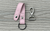 BANDI Key chain in blush pink color shown with key ring on one end of strap and removable clip on the other end