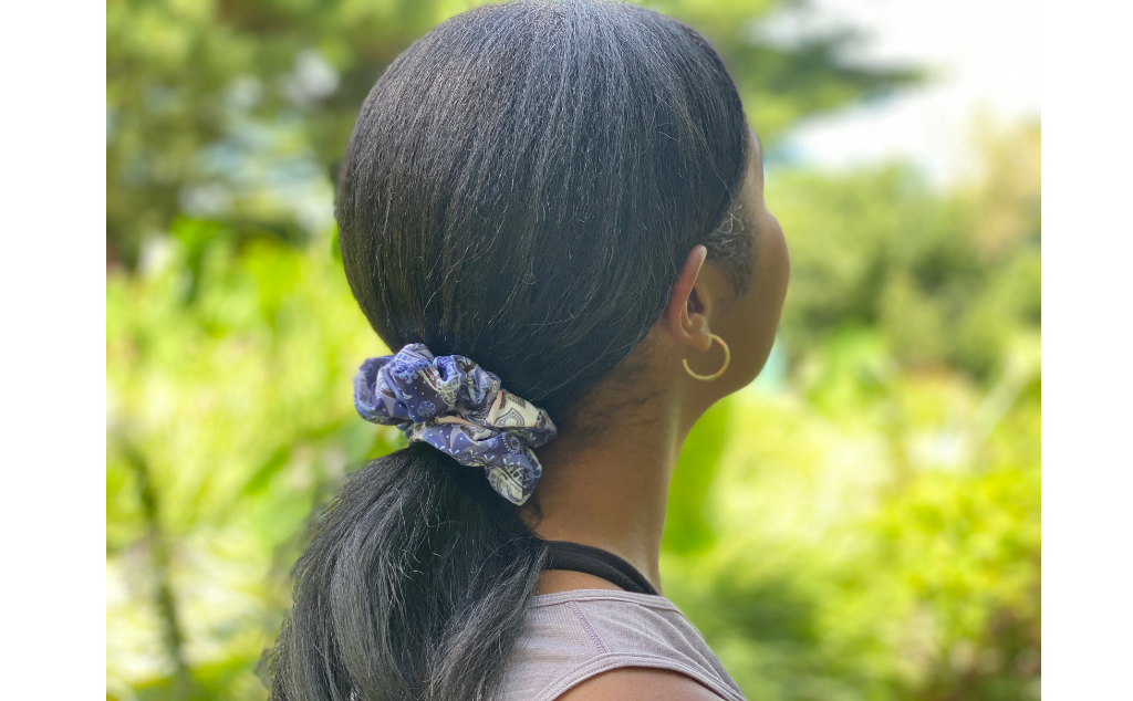Model wearing BANDI blue bandana scrunchie in a ponytail