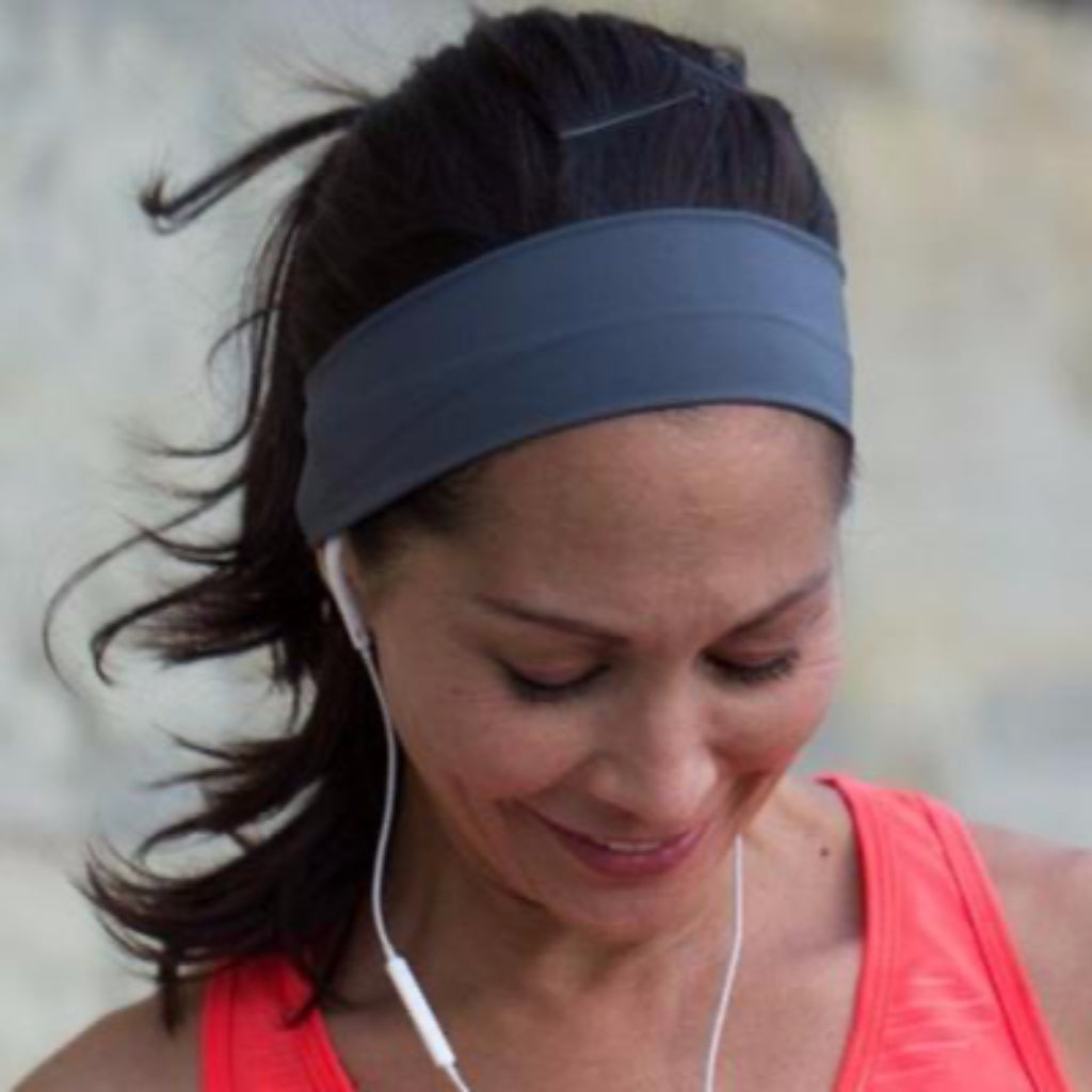 Woman exercising wearing BANDI Grey headband